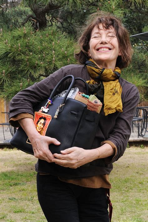 jane birkin carrying a bag